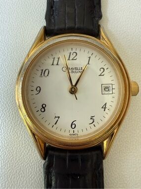 Caravelle by Bulova Gold Tone Classic Watch with Black Strap